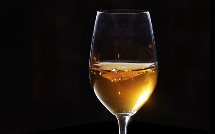 A glass of sparkling white wine 