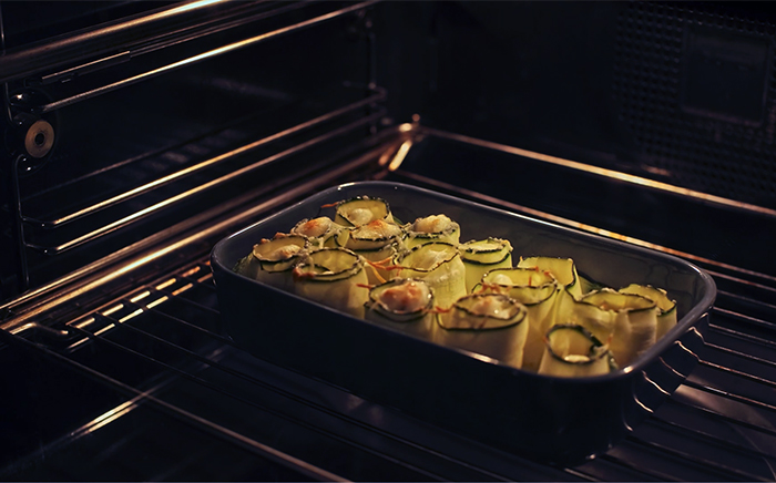 Zucchini recipe in a glass platter in the oven