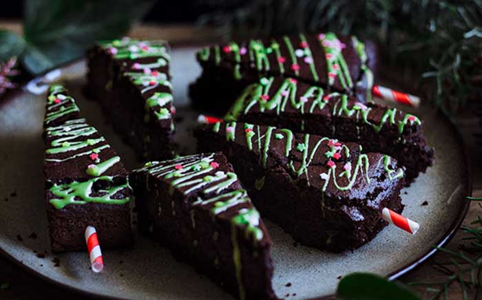 Christmas tree brownies on a white plate