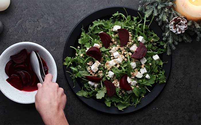 Beetroot salad on a black plate for Christmas
