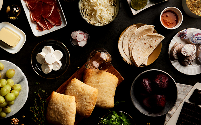 Lunch or dinner dishes on a black table ready for Christmas