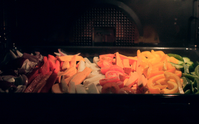 Different colours veggies cooking in the oven