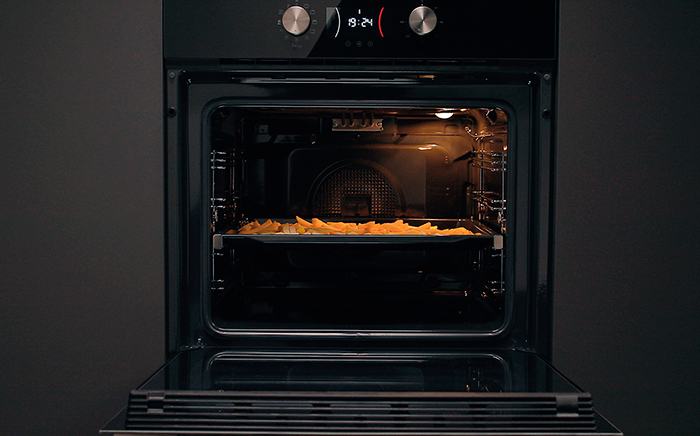 Crispy French fries inside an Airfry oven with air fryer oven function