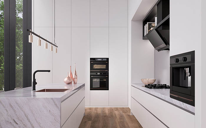 Ambient kitchen picture with black appliances and marble surfaces