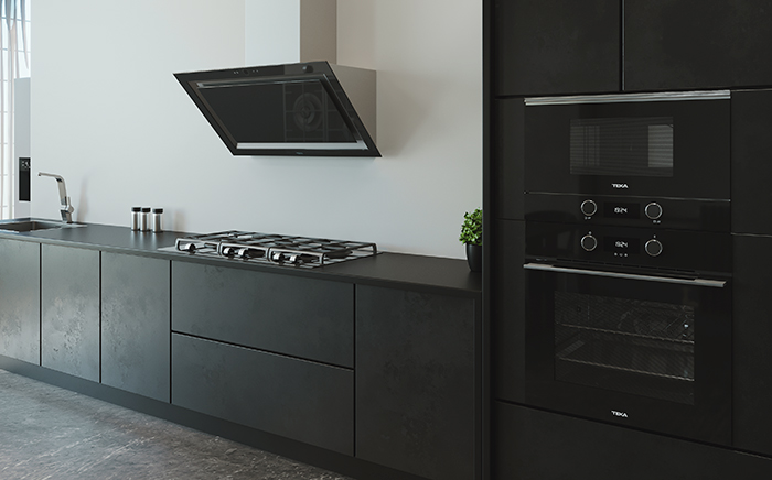 Kitchen with black appliances like friddge, hood and hob