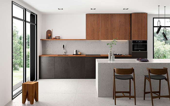 Modern kitchen with black cabinets and appliances and white walls