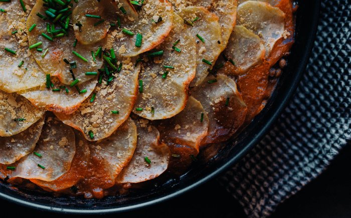 A plate of mushrooms, lentils, and potato pie as an option for a healthy Christmas with vegan menu