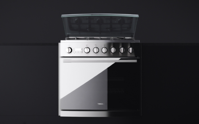 Modern Teka hob with oven integrated over black background
