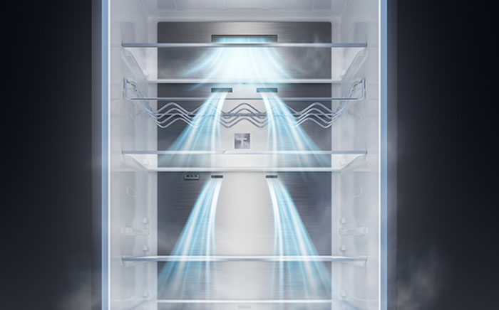 Illustration of cool airflow currents circulating evenly across shelves inside a stainless steel refrigerator interior.