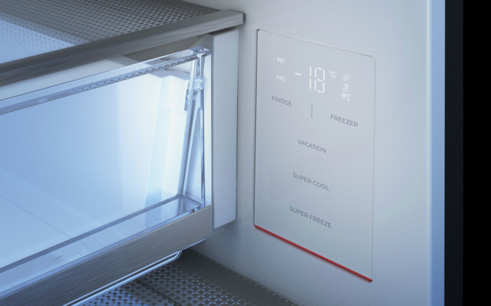 Close-up of an electronic digital control panel mounted on the interior wall of a refrigerator showing temperature and mode settings.
