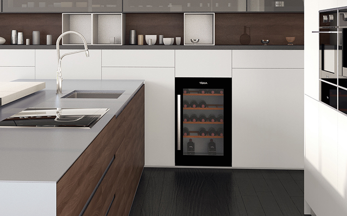 A Teka wine cooler to store wine in a white kitchen