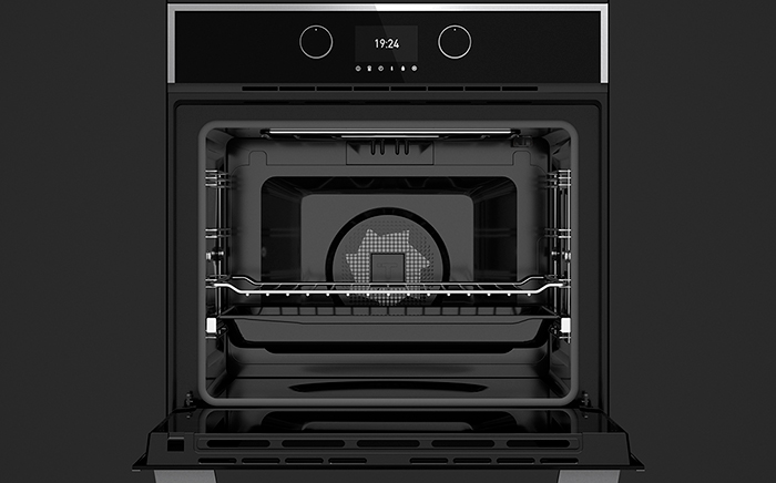 Open oven where we can see the fan at the bottom and one of the racks