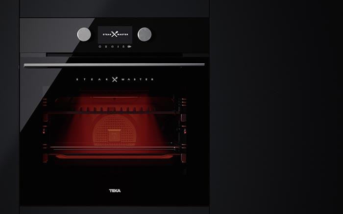 Front of the SteakMaster oven by Teka with the red light inside