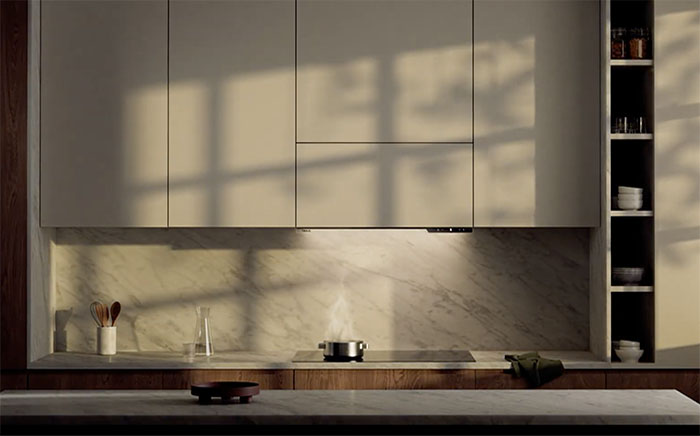 Full shot of a white modern kitchen with a Integra cooker hood by Teka under the cabinet over the hob
