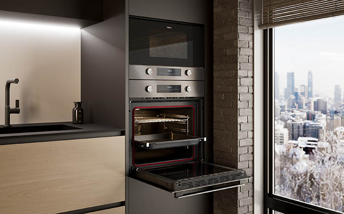 Teka's NEO series oven and microwave build in column and open besides a window with urban landscape