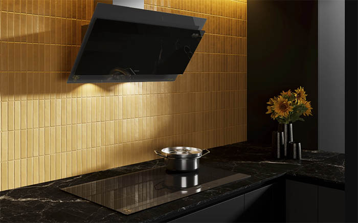 Dark and yellow kitchen with black hood and hob from the Van Gogh Museum edition by Teka with a bunch of sunflowers on the right